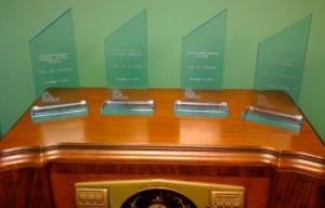 The awards we won on top of one of many console radios owned by Sam