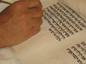 sofer inscribing on scroll